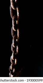 Rusty Chain From Agricultural Machinery With Dark Background