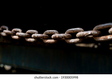 Rusty Chain From Agricultural Machinery With Dark Background