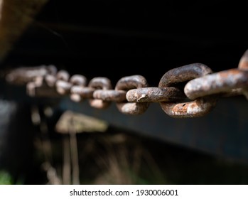 Rusty Chain From Agricultural Machinery With Dark Background