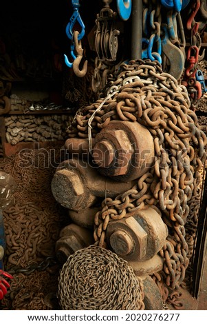 Rusty chains and locks inside an old factory
