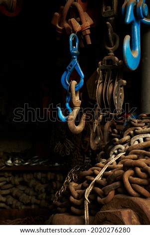 Rusty chains and locks inside an old factory
