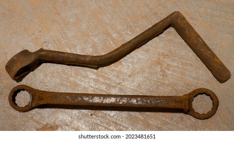 A Rusty Crank Handle And Wrench