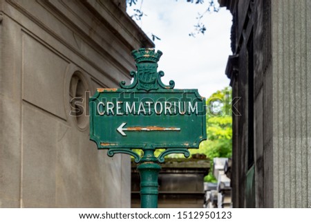 Rusty Crematorium sign in Pere Lachaise Cemetery - Paris, France.