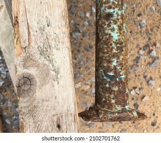 Rusty, Dirty, Old Pillar Next To The Wood