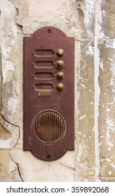 Rusty Door Bell Plate On An Abandoned House Entrance