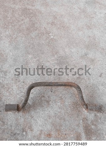 A rusty door handle that has many stories to tell