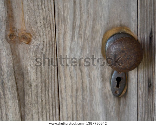 Rusty Door Knob On Old Log Stock Photo Edit Now 1387980542