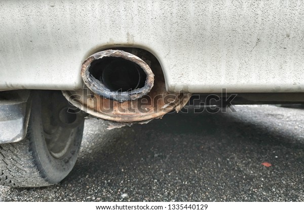 rusty exhaust pipe of a dirty\
car