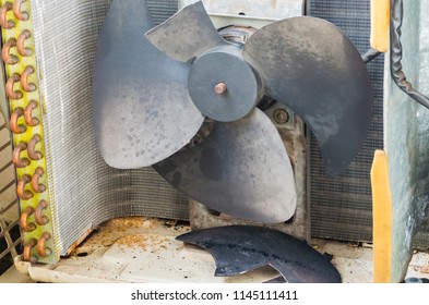 Rusty Fan In Air Conditioning Compressor Unit With A Broken Blade.