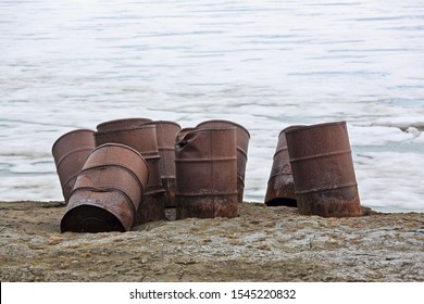 Rusty Fuel And Chemical Drums On Arctic Coast
