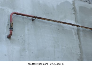 Rusty Gas Pipe At Light Wall Outdoors, Low Angle View