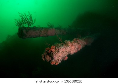 Rusty guns and main structure of HMCS Yukon in San Diego