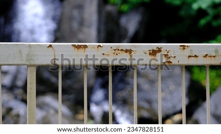 Rusty handrail with bokeh background