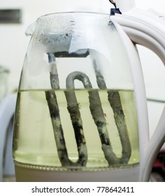 A Rusty, Heated, Scaled Element In An Electric Glass Teapot. The Concept Of  Limescale On The Heating Elements Of Household Appliances.