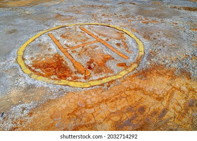 Rusty Helipad Sign Over Contaminated Ground Of Abandoned Mining Area, Dystopian Background