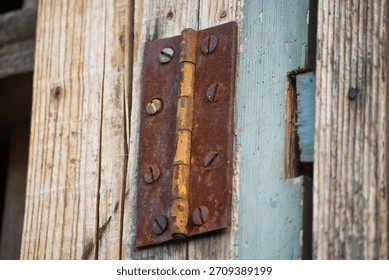 Rusty hinge forgotten in time
