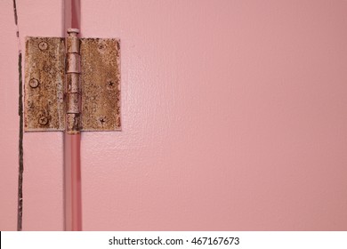 Rusty Hinge On Beachside Bathroom Door