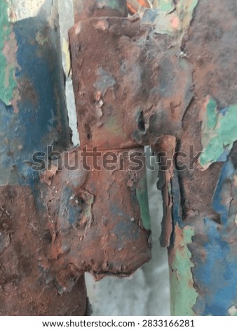 rusty hinge, rust, corroded, metal, iron, hinge, door hinge, hardware, blue paint, peeling paint, old, vintage, weathered, urban decay, grunge, abandoned, industrial, gate, fence, construction, dirty, rough, detail, macro, close up, decay, neglect, gritty, distressed, aged, worn, damaged, rusty metal, corrosion, oxidation, orange, blue, brown, weathered surface, rough surface, outdoor, abandoned building, infrastructure, deteriorated, grungy, old metal, corroded metal, industrial background