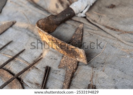 rusty hoe in the blacksmith's forge