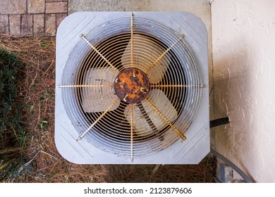 Rusty HVAC Air Conditioner In Need Of Repair. Top Down View Of Old AC Unit Fan.