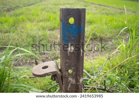 rusty iron with 4 holes with rice fields in the background. ストックフォト © 