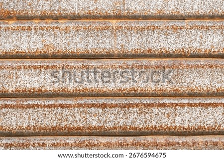 Rusty iron gate surface. Corroded industrial background. Weathered steel detail. Old damaged texture. Metallic decay with corrosion. Vintage rough material. Industrial grunge backdrop. Timeworn iron.