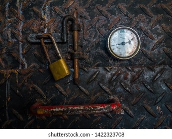 Rusty Locked Oven Door With A Temperature Meter