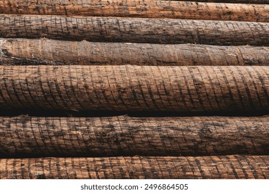 rusty logs stacked. You can see the logs horizontaly lying on each other - Powered by Shutterstock