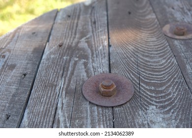 Rusty Metal Bolt. Rusty Metal Bolt And Nut On Wooden Surface