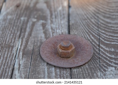 Rusty Metal Bolt. Rusty Metal Bolt And Nut On Wooden Surface