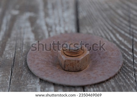 rusty metal bolt. rusty metal bolt and nut on wooden surface