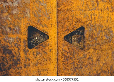 Rusty metal plate texture with triangular shape cut holes