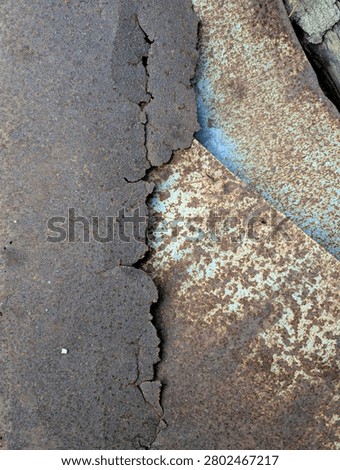 Rusty metal surface with peeling paint and corroded texture close up