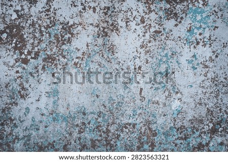Rusty metal texture background with peeling blue paint closeup. Weathered corroded iron surface with flaking light blue paint layers and brown rust spots, old industrial rustic wall material for grunge design backdrop.