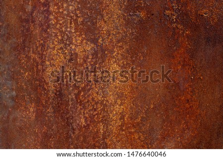 Rusty metal texture. Rusty metal painted red. Surface of old rusty metal sheet coated with corrosion