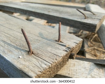 Rusty Nail On Crack Wood