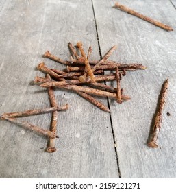 rusty nails scattered on the wood