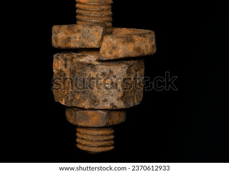 rusty nut. Rusty iron rod with screw threads. Rusted mechanical components. threaded bolt and nut isolated close up. dismantling concept, difficult to unscrew, non-removable. selective focus