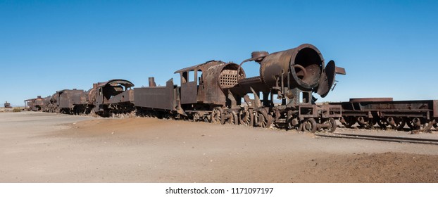 Rusty old and abandoned trains at the Train Cemetery (Cementerio de Trenes) in Uyuni desert, Bolivia - South America - Shutterstock ID 1171097197