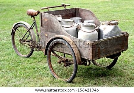 rusty old bikes of ancient milkman with aluminium drum