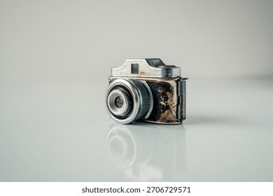Rusty old camera with reflection exploring history of photography equipment