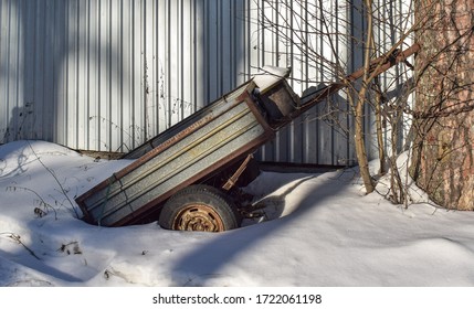 Rusty Old Cargo Trailer In The Snow.