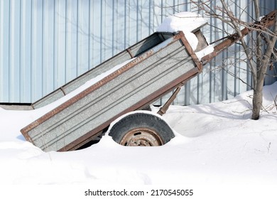 Rusty Old Cargo Trailer In The Snow.