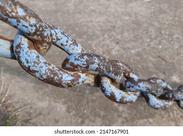 rusty old chain, symbol for freedom and release from the burden. Old iron chain with rust on it