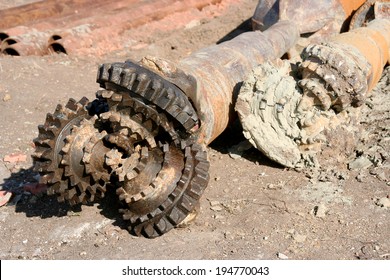 Rusty Old Drilling Bit Caked With Mud And Dirt