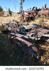 Rusty Old Farm Equipment Abandoned In A Field 