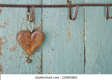 Rusty Old Heart On Wooden Rustic Green Background