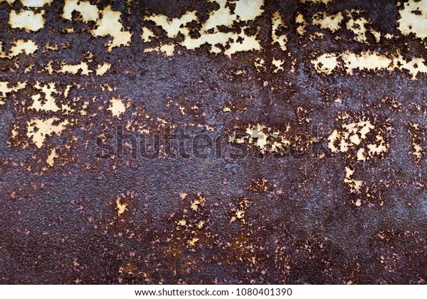 Rusty\
old metal texture with white peeling paint and brown rust\
underneath, suitable for adding text, copy space\
