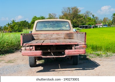 Rusty Old  Pickup In Farm