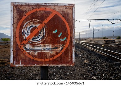 Rusty Old Railroad Sign Showing The End Of The Station Platform With A Big Red Circle Strike Through